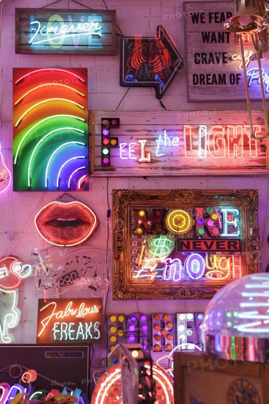 Room full of bright colourful neon signs