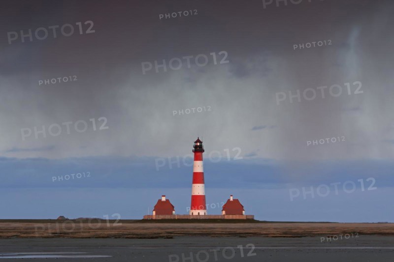 Downpour over the lighthouse Westerheversand at Westerhever