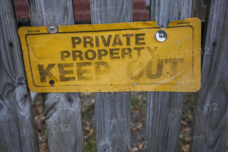 Keep Out sign on a wooden fence