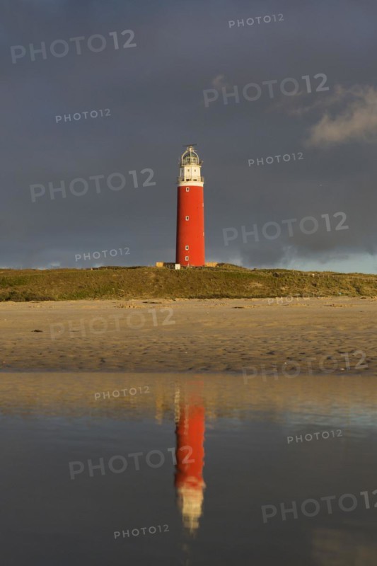 Eierland Lighthouse in the dunes during stormy weather on the northernmost tip of the Dutch island of Texel