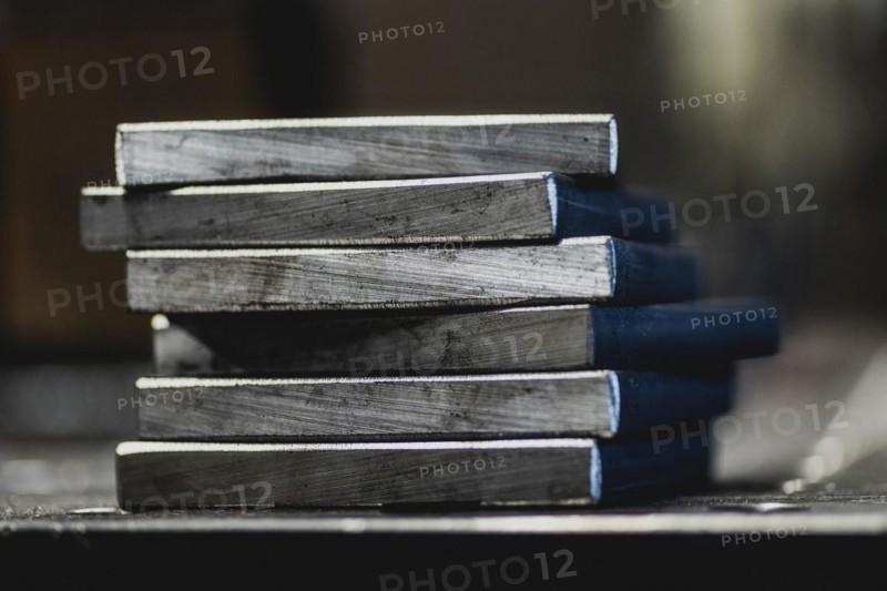 Metal plates lying on a workbench