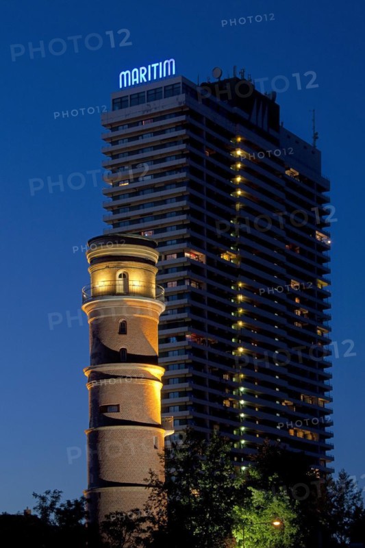 Maritim Hotel and the old lighthouse in the port of Travemuende at night