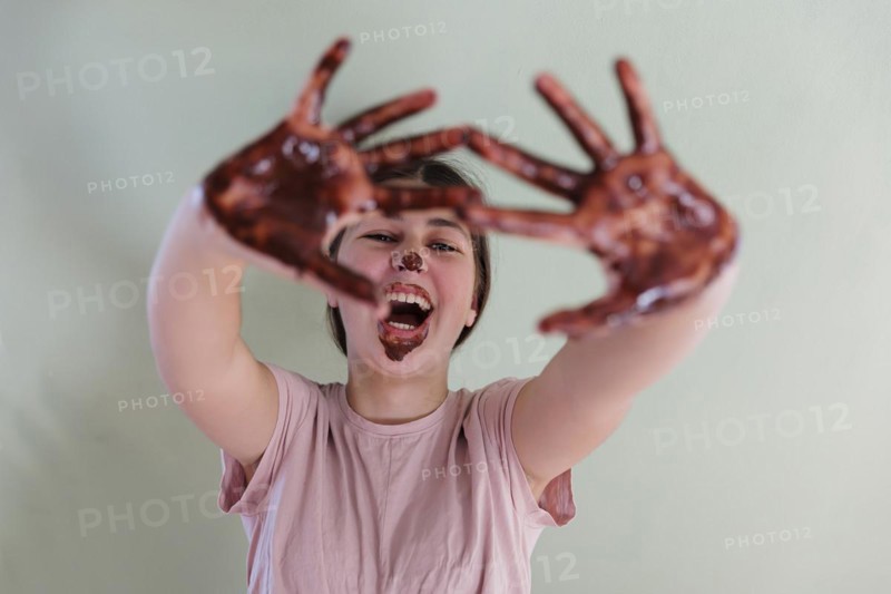 Girl with a chocolate-smeared mouth