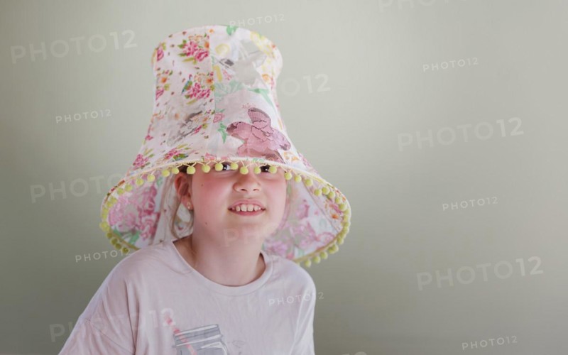Girl with a lampshade on her head