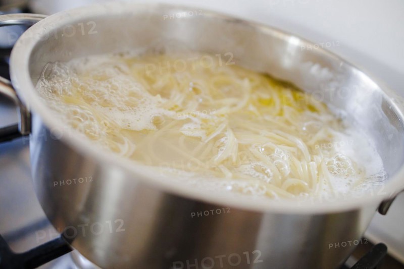 Symbol photo on the subject of cooking pasta. Cooking spaghetti in a saucepan. Berlin