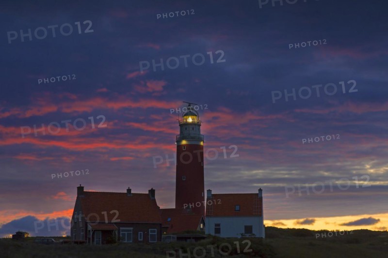 Eierland Lighthouse in the dunes at sunset on the northernmost tip of the Dutch island of Texel