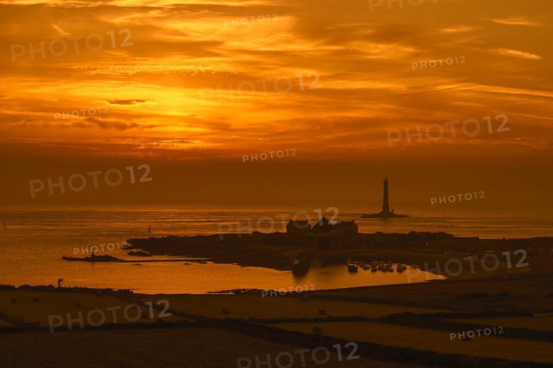 Lighthouse and lifeboat station in the Goury port near Auderville at the Cap de La Hague at sunset