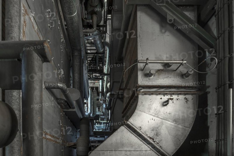 Heating pipes in the power house with boiler plant of a former paper factory
