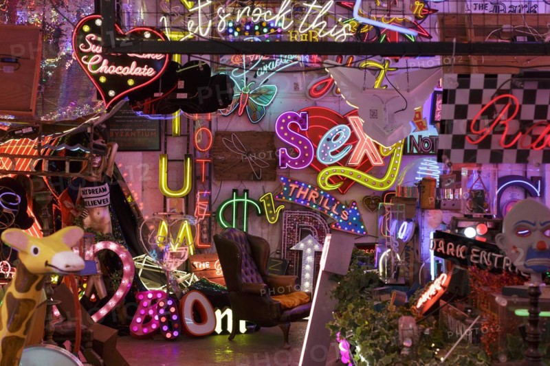 Room full of bright colourful neon signs