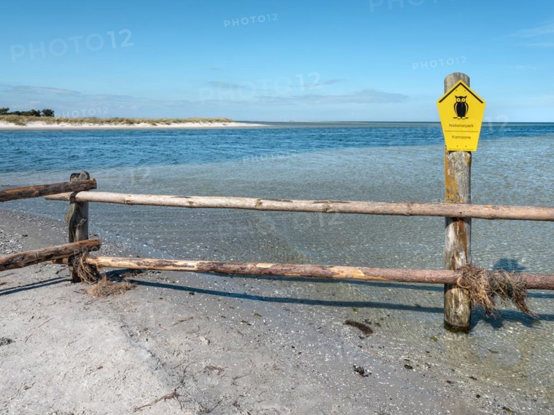 Fence on the beach of the Baltic Sea as the border of the closed-off core zone of the National Park Vorpommersche Boddenlandschaft