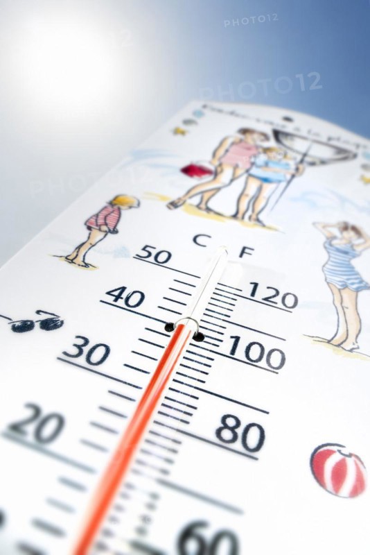 Worm's-eye view of thermometer measures extremely hot temperature of 40 degrees Celsius