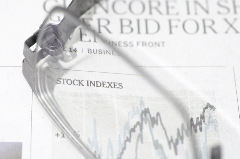 Financial Newspaper and Eyeglasses