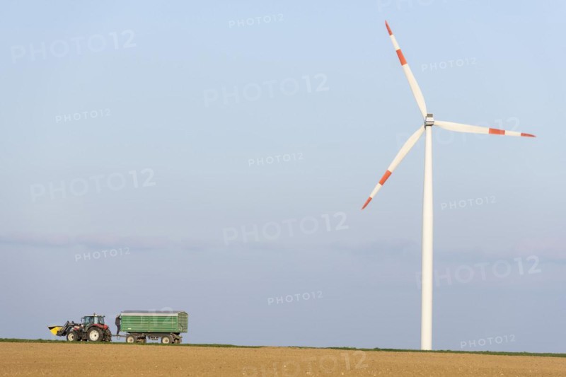 Tractor with trailer in a field