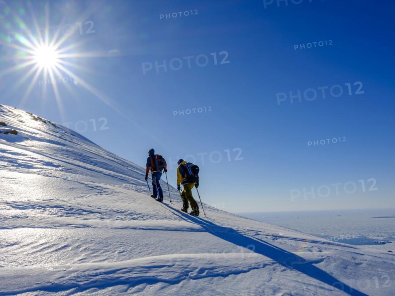 Climbers climb over ice on the local mountain