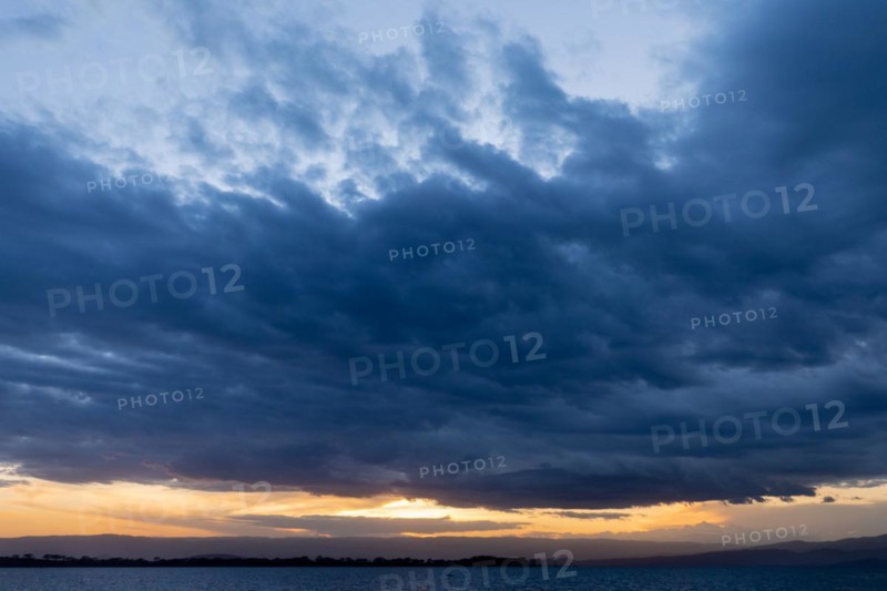 Sea of clouds over a lake