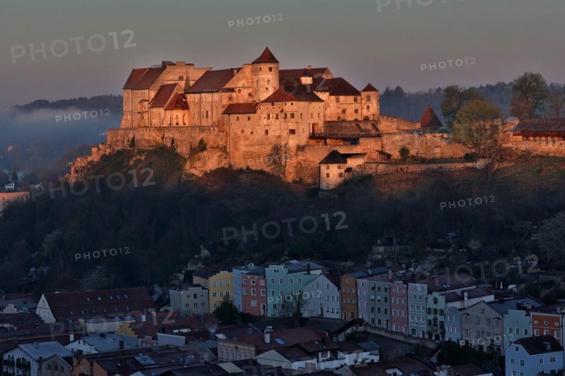 The castle in Burghausen in the first morning light above the historic old town