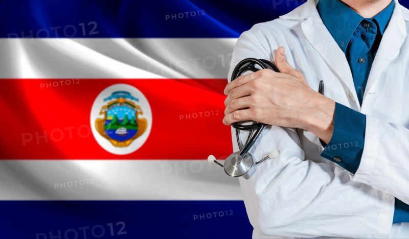 Doctor with stethoscope on Costa Rica flag. Health and care with flag of Costa Rica. Costa Rica national health concept