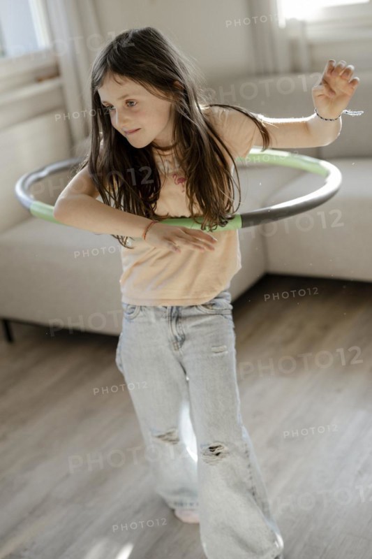 Girl gymnastics with hula hoop
