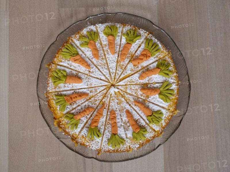 Homemade carrot cake on a glass plate