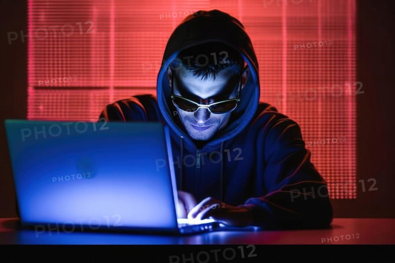 A young man in sunglasses and hoodie