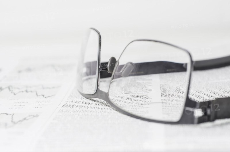 Financial Newspaper and Eyeglasses
