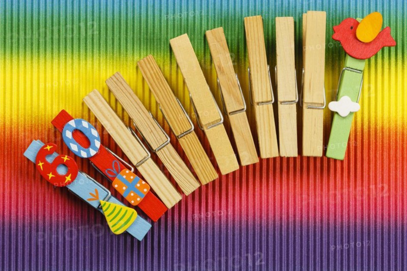 Clothes pegs and number 60