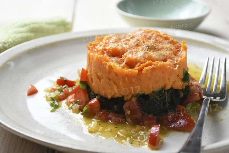Sweet potatoes with kale served on a plate