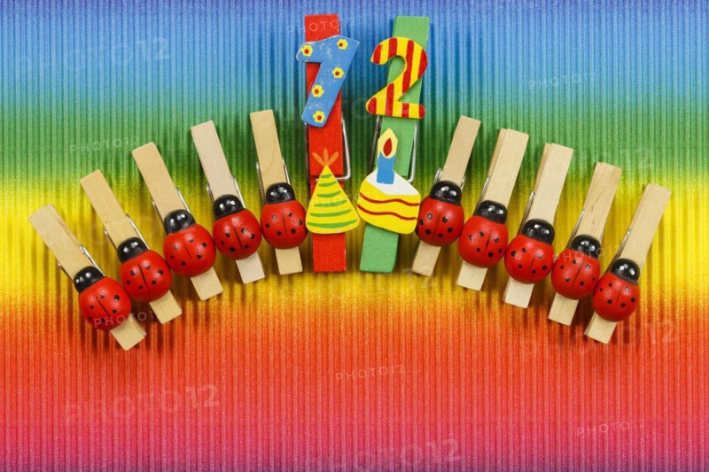 Clothes pegs and number 12