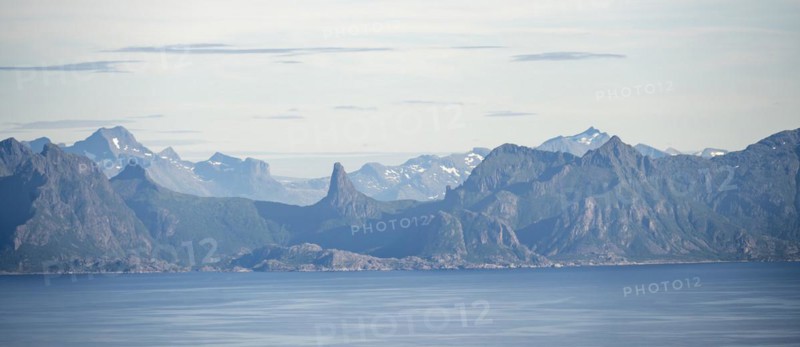 Pointed rocky mountains and sea