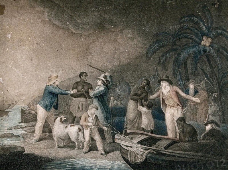 Slave traders have arrived on an island to enslave some of the black inhabitants. A desperate man sits in a boat