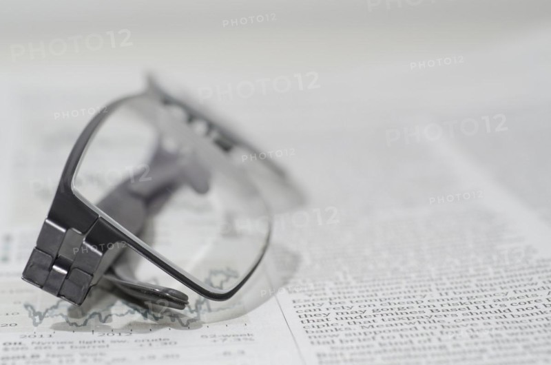 Financial Newspaper and Eyeglasses