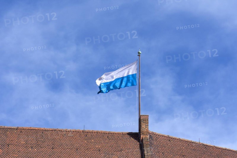 Waving Bavarian flag on the roof of the Kaiserburg