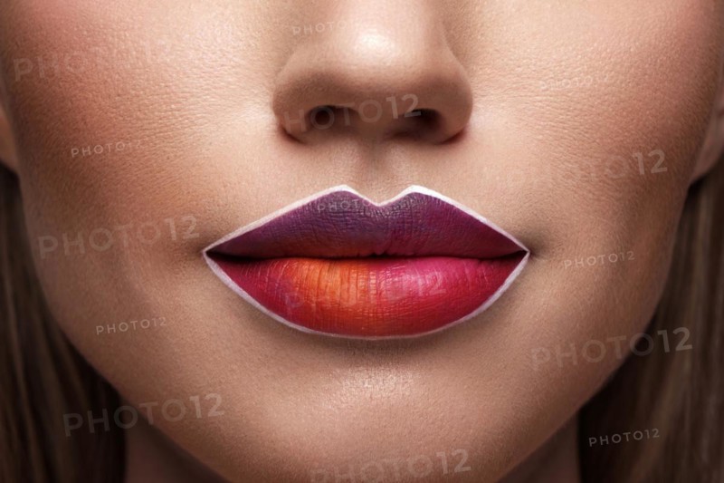Beautiful caucasian woman with creative makeup and purple lips. Beauty face. Art makeup
