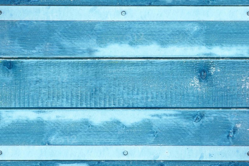 Wooden background with blue colored planks