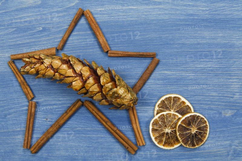 Star of cinnamon sticks on a blue background