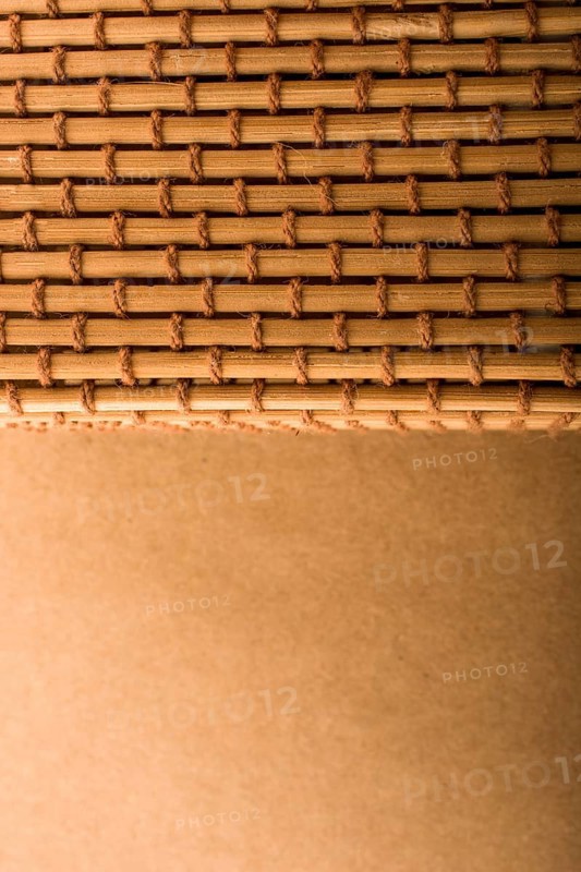 Straw mat and brown background for background usage