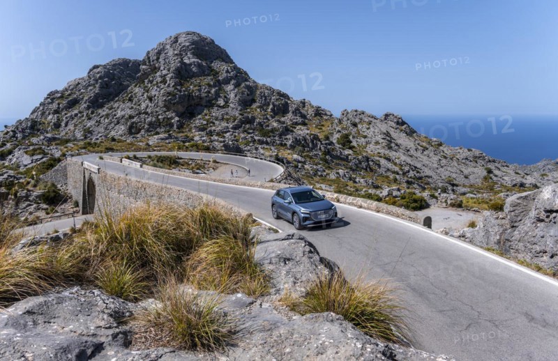 Car on mountain road with many curves to Sa Colobra