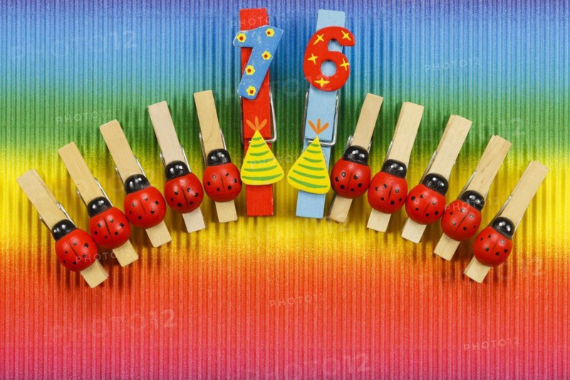 Clothes pegs and number 16