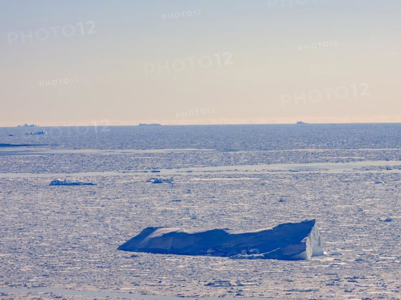 Iceberg frozen in pack ice