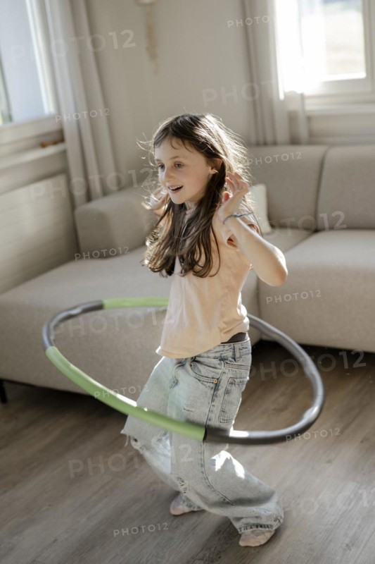 Girl gymnastics with hula hoop