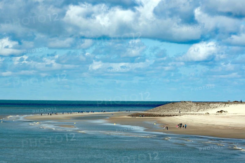 Wide sandy beach with few people