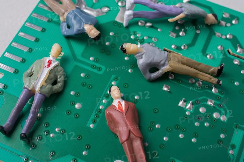 Tiny figurine of men model on Circuit board of electronics