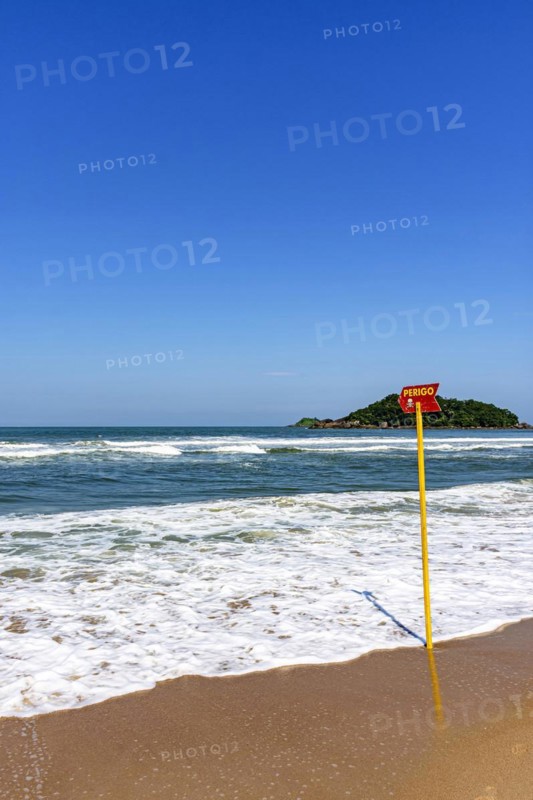 Paradise beach with danger warning from waves and sea currents in Bertioga in the state of Sao Paulo