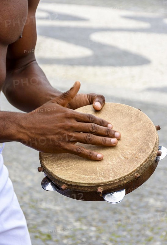 Instrumentalist playing tambourine in the streets of Pelourinho in Salvador in Bahia