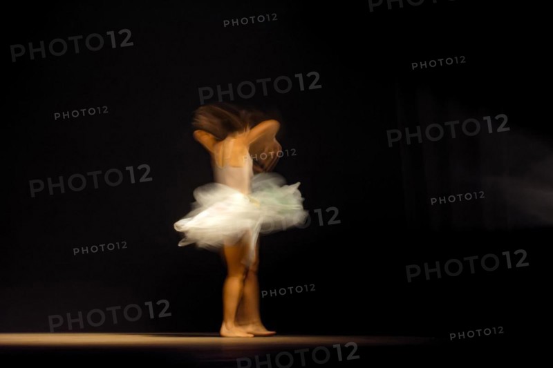Young dancer with motion blurred during presentation of modern dance show