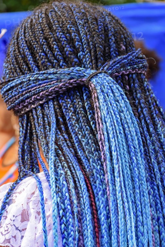 Long blue braids worn by a member of a carnavaval association in Rio de Janeiro for presentation