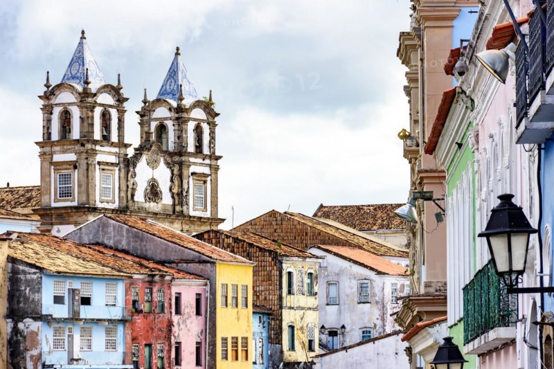 Colorful historic district of Pelourinho with cathedral tower on the background. The historic center of Salvador