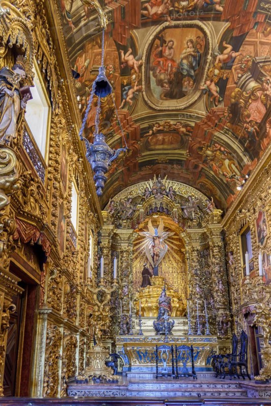 Interior and altar of a brazilian historic ancient church from the 18th century in baroque architecture with details of the walls in gold leaf in the city of Rio de Janeiro