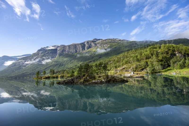 Mountains reflected in blue lake