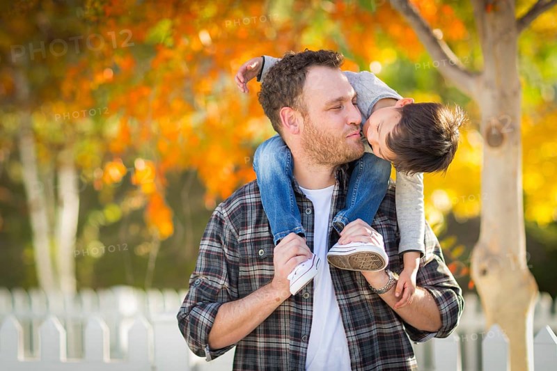 Outdoor portrait of multiethnic chinese and caucasian father and son